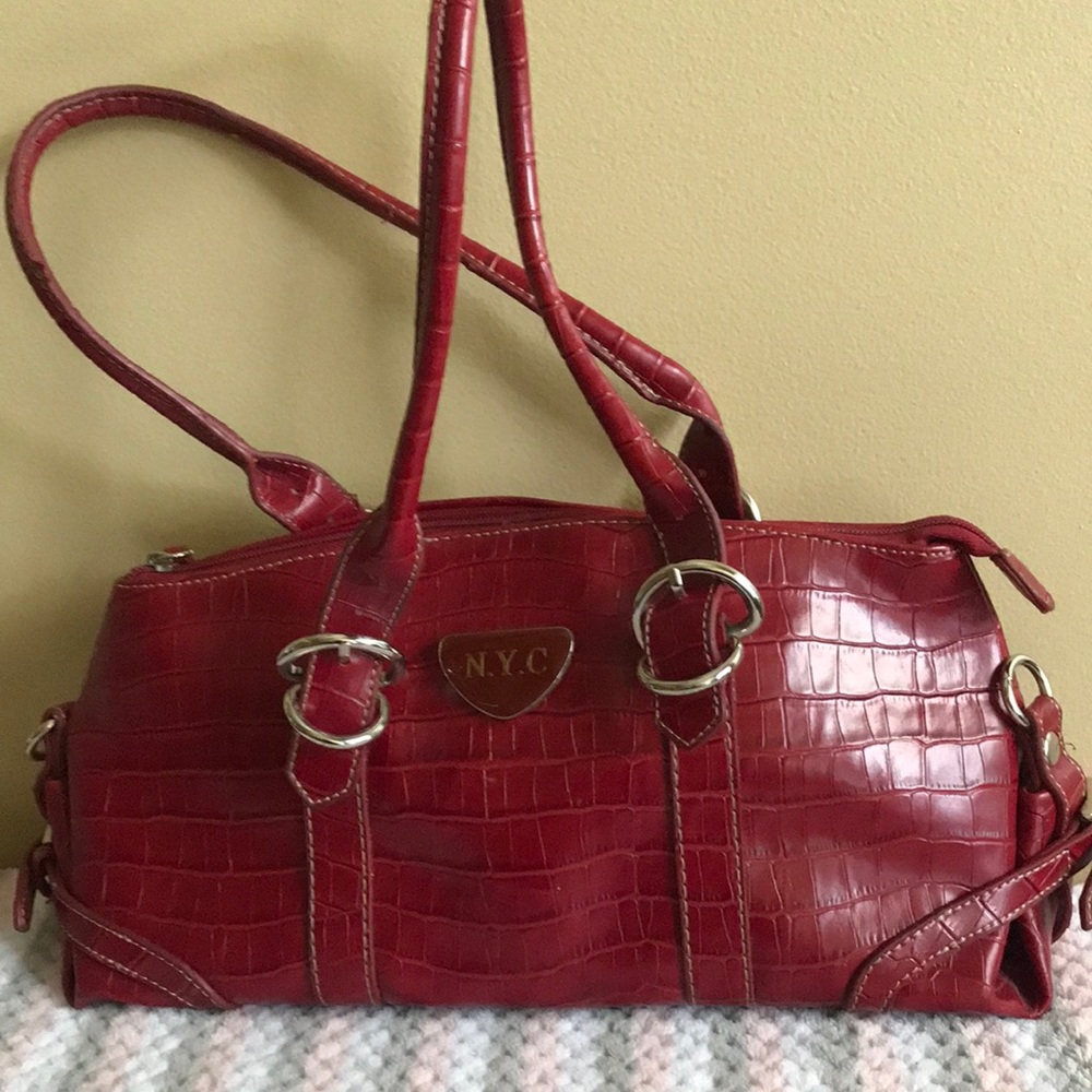 Nice size used red hand bag good condition little wear on handles